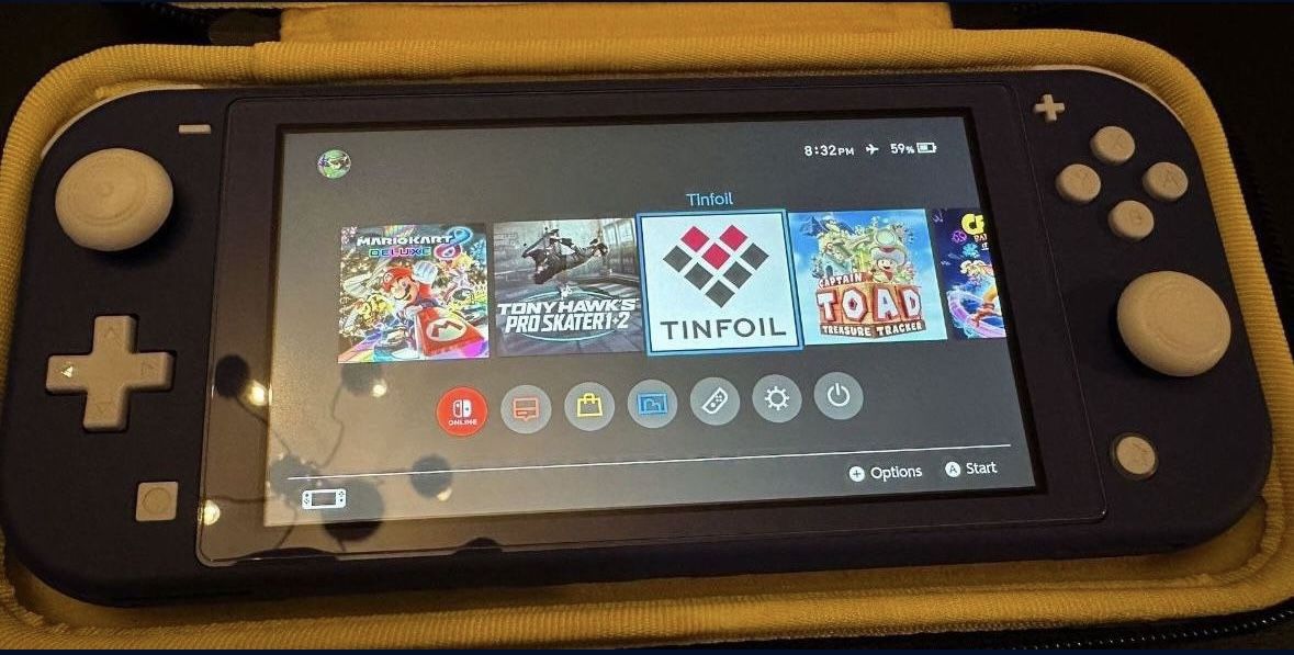 Modded Nintendo Switch Lite + 1TB Micro SD Loaded With Games CFW
