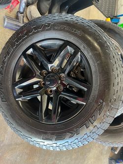 265/70R18 Falken Wildpeak A/T3W Tire on Black Wheel