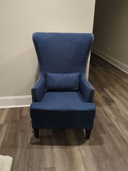 Blue wingback chair with silver nailhead