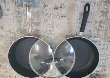 Pair of Nonstick Frying Pans - Black Skillet w/ Glass Lid + Green Skillet  Selling a duo of versatile 10-12" nonstick frying pans perfect for everyday