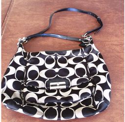 Midsize black and white coach purse