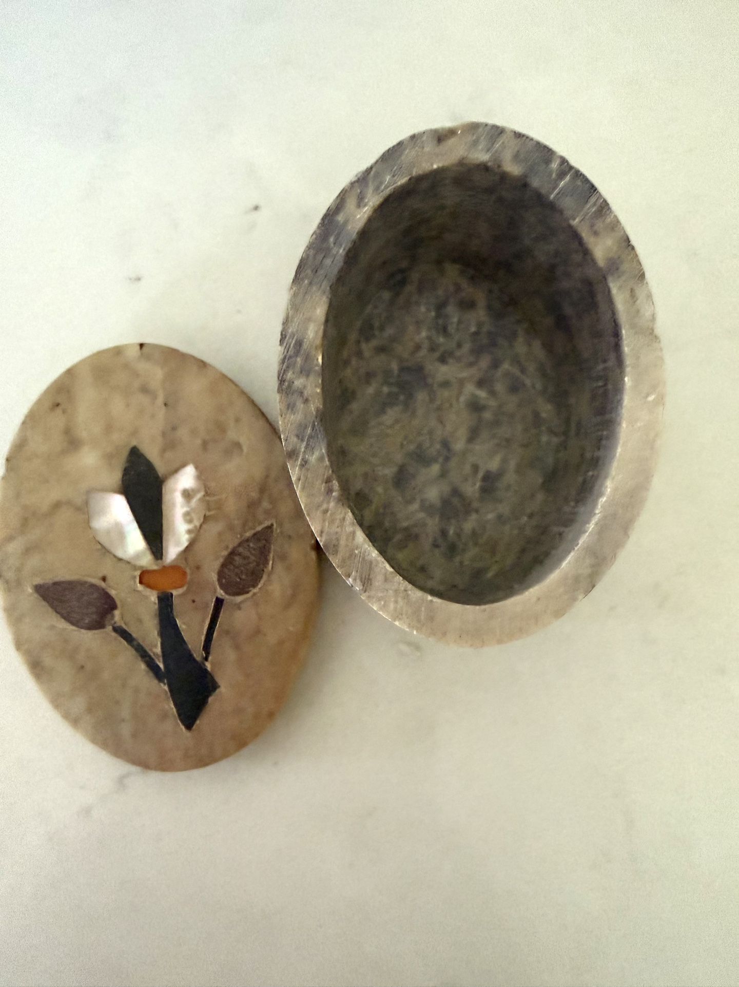 Stone Inlaid Floral Trinket Box Unique stone box with a pretty inlaid floral design. Oval shape. Good for holding little trinkets or jewelry. Inlay h