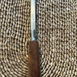 sharpening steel featuring a wooden handle,