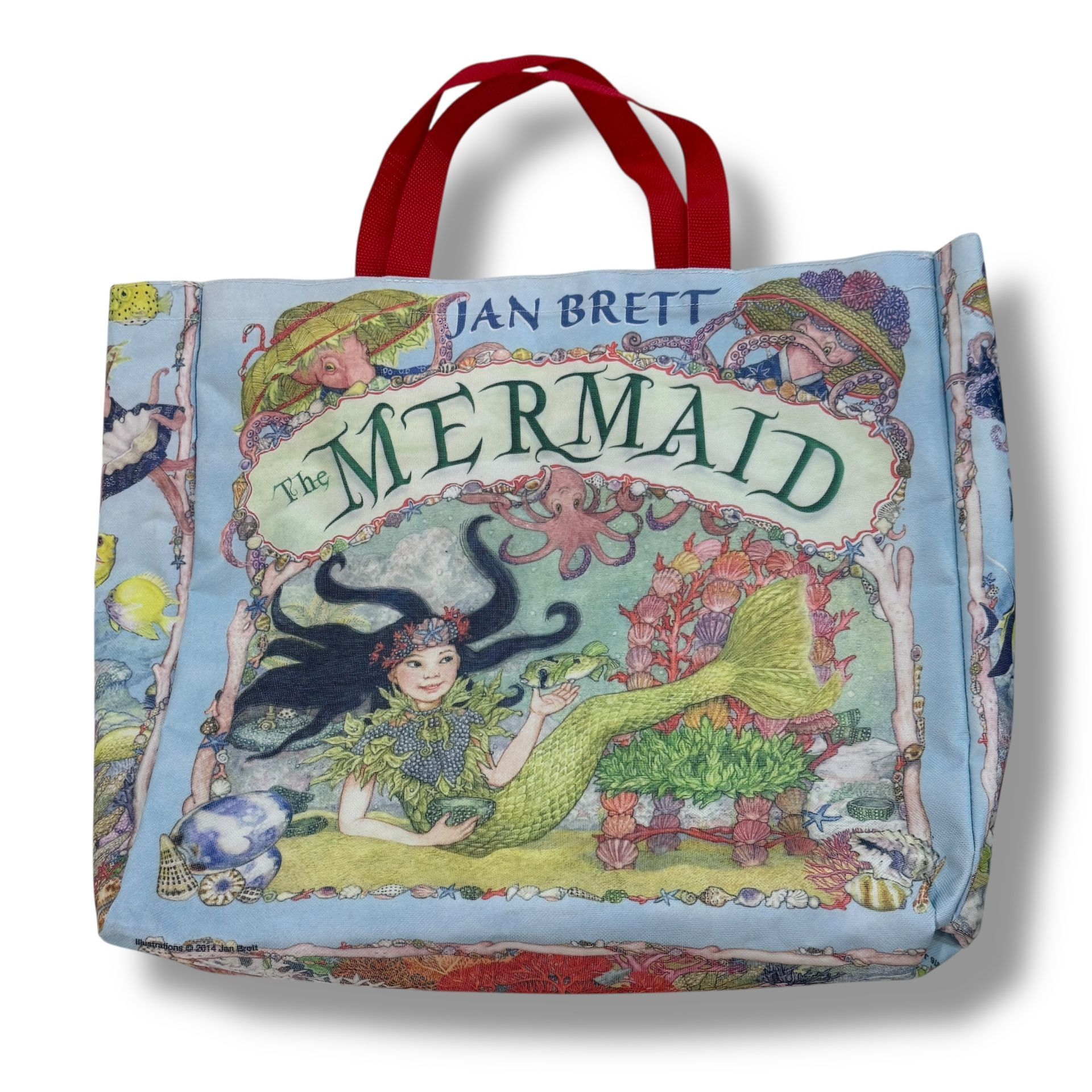 Jan Brett Canvas Tote Bag with Red Handles Promotional Item The Mermaid Book The Jan Brett Canvas Tote Bag with Red Handles is a large tote bag feat