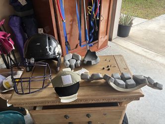 Football helmet outer shell and  pads for the inside helmet