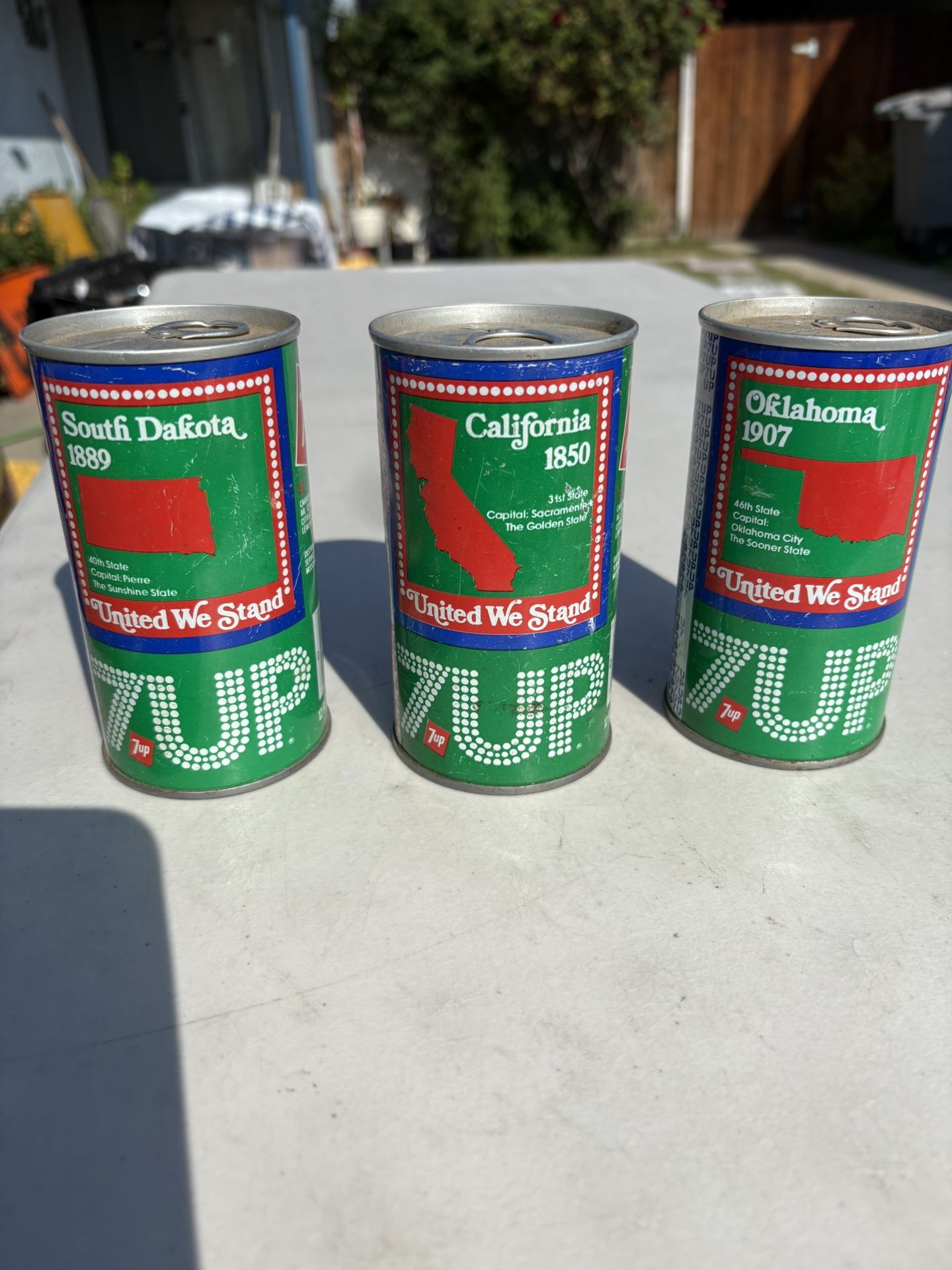 Vintage 7up State Cans