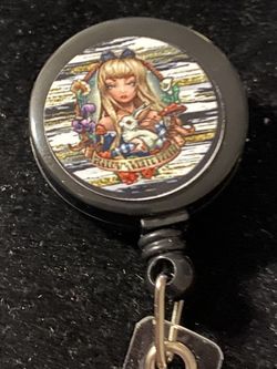 Alice in wonderland badge reel