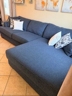 Beautiful dark blue sectional couch with extra wide chaise from Jerome’s