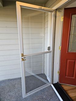 Storm door with mounting hardware