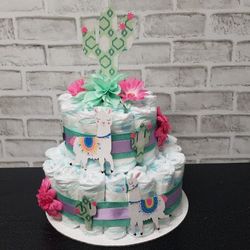 Girls 2 tier Llama diaper cake w custom onesies.