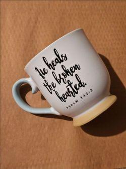White Ceramic Mug with Scripture Quote "He heals the broken hearted."