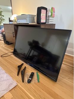 toshiba 43” smart TV with remote and stand