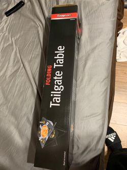 Snap on folding tailgate table