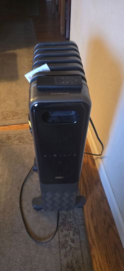 Dreo Oil-Filled Radiator Heater, a 1500W electric portable space heater with a digital display
