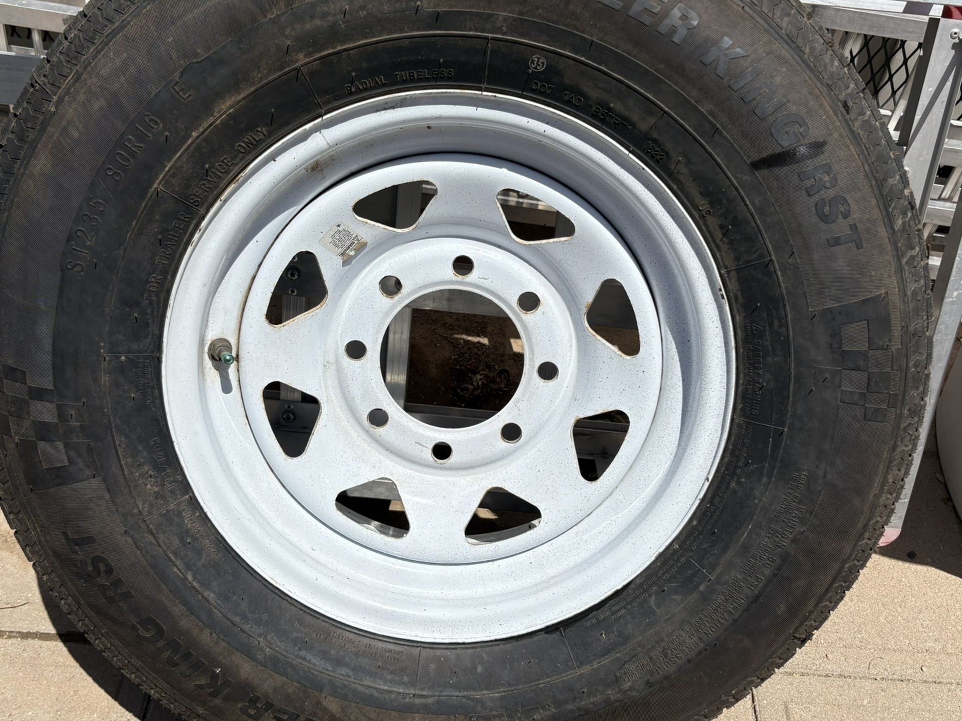 Trailer spare tire eight lug St235/80R/16 R load range E. Trailer King RST. Only used one time when we had a flat. Location 24th St. in Bell Road.