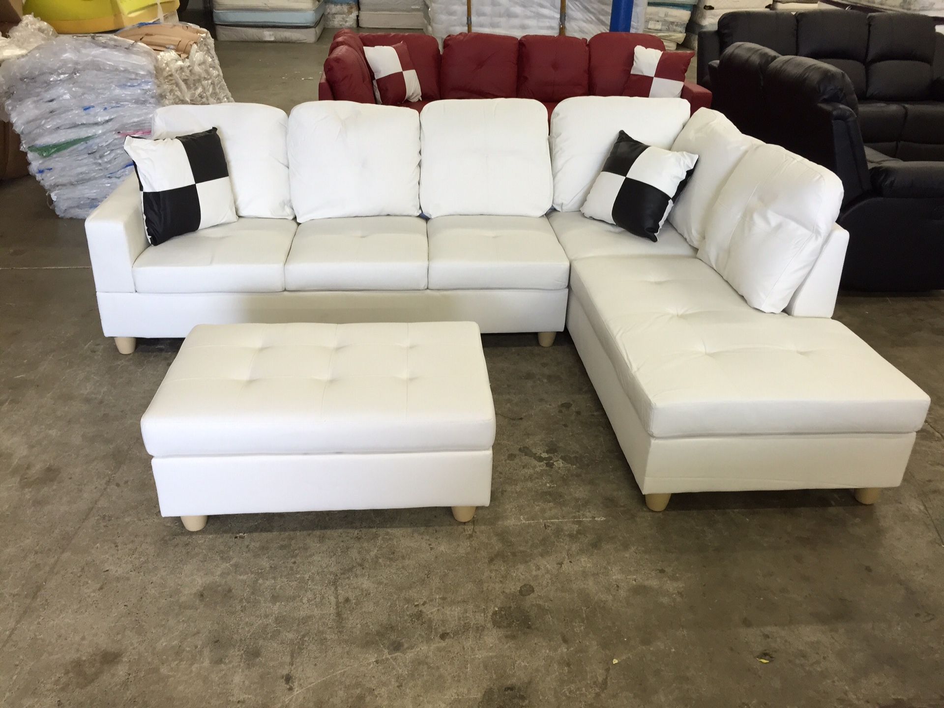 White leather sectional couch and storage ottoman