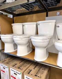 American Standard Champion Two-Piece 1.28 GPF Single Flush Elongated Chair Height Toilet with Slow-Close Seat in White