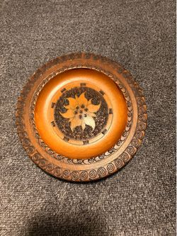 Vintage Polish folk art hand-carved wooden plate featuring intricate pyrography (wood burning) and metal/brass inlay.