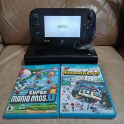 Black Nintendo Wii U with two games and cables