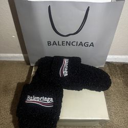 Black balenci fur slides