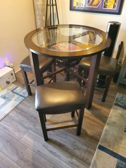 Round glass table with chairs