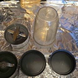 Nutribullet 24 oz cup with extractor blade, milling blade, and 2 Stay-Fresh re-sealable lids. Cup,Blades and lids are in good condition for $12