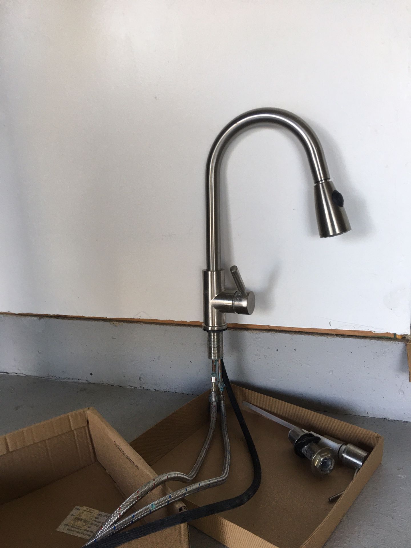 Sink faucet. Kitchen, garage, basement sink stainless steel.