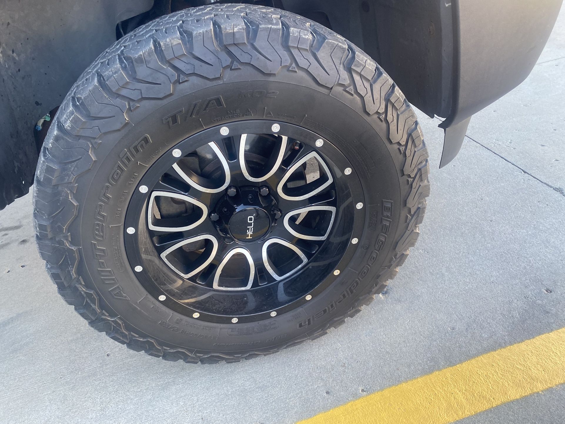 HELO RIMS 6x5.5 bolt pattern. and TIRES 285/65R18 ALL- TERRAIN! Both like new
