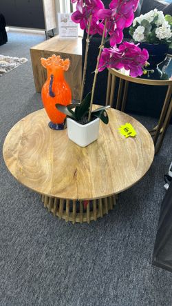 Round natural wood coffee table