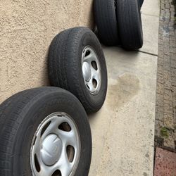 4 Toyota Rims w/ used tires