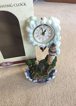 Collectible lighthouse swing clock
