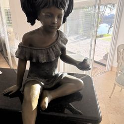 Bronze Girl Holding A Bird 