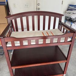 Baby changing table and bed.
