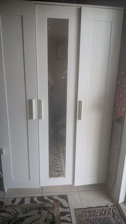 white IKEA armor double doors and mirror
