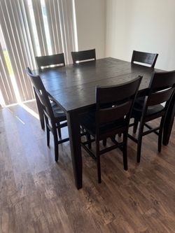 Wood table with six chairs