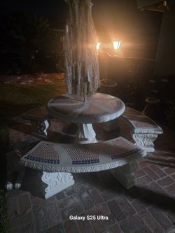 Concrete benches and table with umbrella