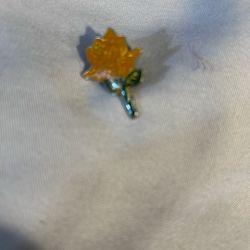 This is a yellow rose floral enamel lapel Pin 