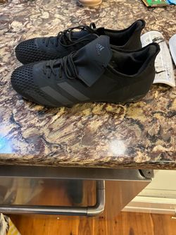 Adidas Soccer Cleats All Black plus Nike Shin Pads