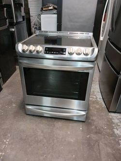 Stove lg with 5 burner slide in stainless steel 40 days warranty Delevery