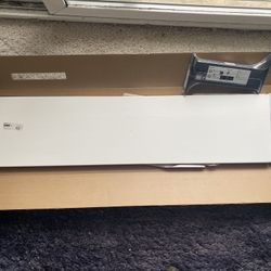 white IKEA Tranhult shelf with black mounting hardware 