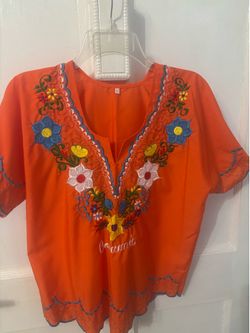 Bella blusa bordada