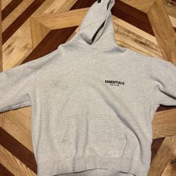 Fear of God Essentials Hoodie in a heather gray