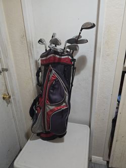 Tommy Armour golf club set.l..5678 irons.4 drivers.sand wedge and putter..bag is a frayed on top