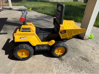Kids riding CAT vehiclee