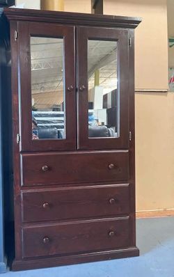 Tall pine closet with mirrors
