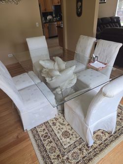 Glass top dinning table with 6 luxury chairs