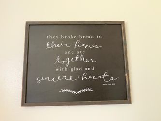 “They broke bread in their homes” framed sign