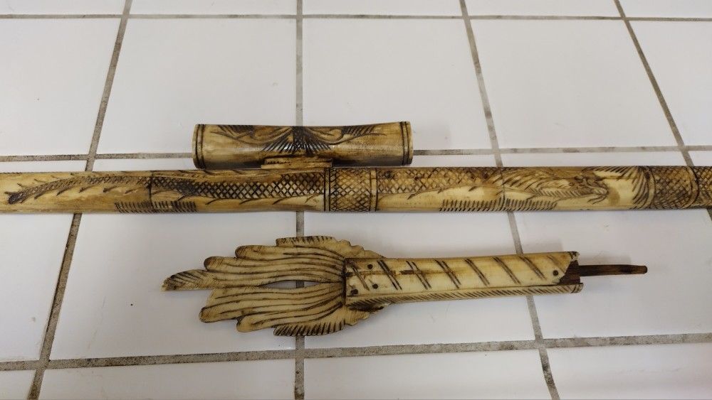 Indonesian dragon shaped carved bone blow dart gun from Borneo It has slight damage and missing some parts and broken parts. Still good for display. S
