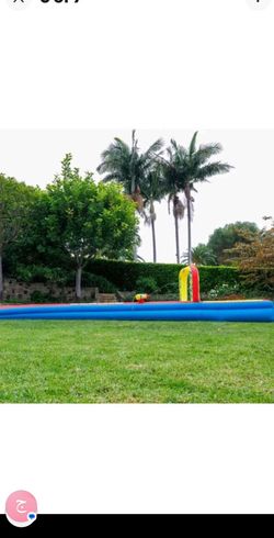 Wham 32 ft constant air slip and slide with a blower