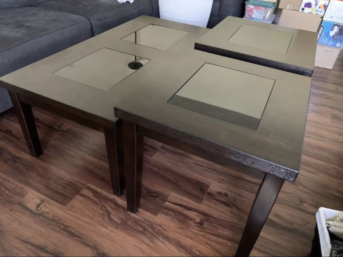 Lightly used espresso coffee/end table set with black tempered glass accent